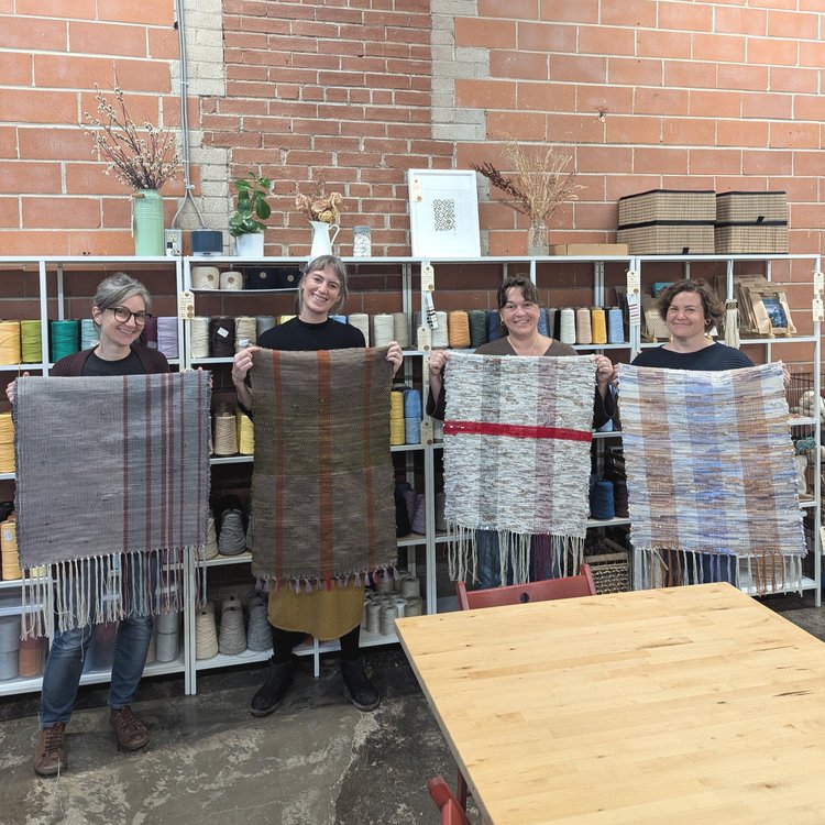 Group with finished rag rugs