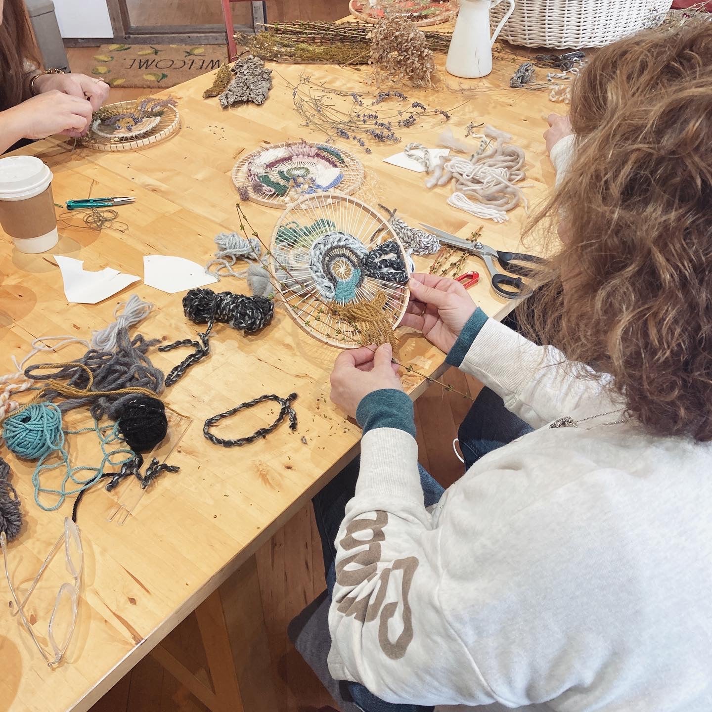 Circular weaving in progress on hoop